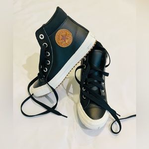 Converse black leather chuck Taylor’s. With brown circle chuck taylor patch